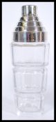 A vintage Art Deco style cocktail shaker with cut