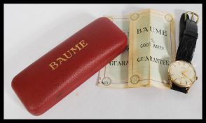 A vintage retro Baume 17 Jewels watch with stick m