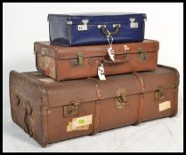 A good stack group of four vintage luggage to incl