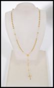 A 9ct gold catholic prayer bead rosary, including