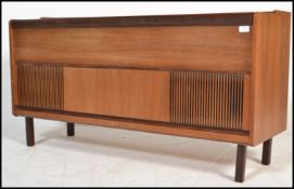 A mid century Danish influence teak wood sideboard - stereogram credenza. Raised on squared  legs