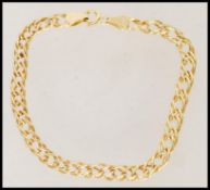 A 20th century stamped 9ct gold bracelet with decorative links and a spring ring clasp weighing 2.