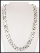 A 20th century gentleman's chain necklace stamped 925 silver to the lobster clasp, having an unusual