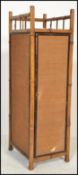 A 19th century Victorian aesthetic movement bamboo cupboard of small proportions having hidden