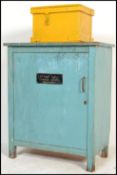 A vintage mid 20th Century painted workshop cabinet / locker, single door to front with flared