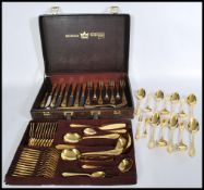 A vintage Solingen of W Germany 23-24 carat gold-plated canteen of cutlery for twelve settings