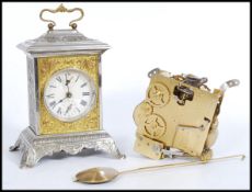 A vintage 20th Century pressed bracket clock, the case pressed with classical scenes together with a