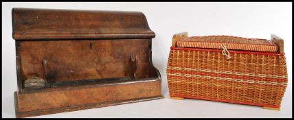 A 19th century walnut desk stationery box with a shaped lid, with a frontal section for ink pots and
