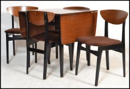 A mid century G-Plan librenza pattern dining room suite comprising drop leaf extending dining