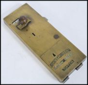 A late 19th Century Victorian / early 20th Century Edwardian brass penny in slot Lockerbie &