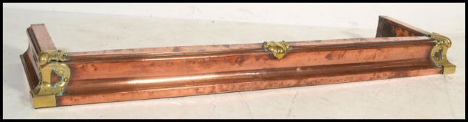 A Victorian 19th century copper and brass embellished rococo influenced fire fender / kerb of square