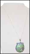 A stamped 925 silver pendant necklace with a pilque a jour owl pendant, and spring ring clasp.