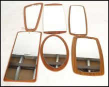 A collection of  vintage / retro teak frameless atomic shaped wall mirrors dating from the 20th