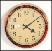 A vintage retro 20th century Synchrome industrial electric wall clock of circular form with