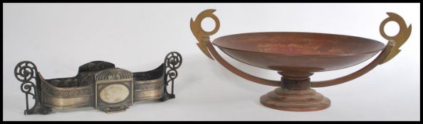 Two table centre pieces to include an early 20th century WMF white metal centre piece with a glass