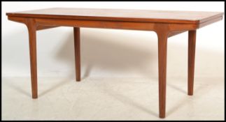 A 1970's teak wood Danish influence extending coffee occasional table. The rectangular top with