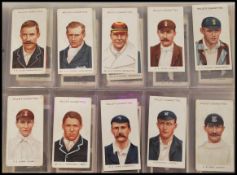 A collection of vintage 20th century sporting cigarette cards in a blue leatherette album