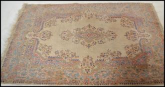 A 20th century Chinese Oriental floor carpet rug having geometric patterns and borders with tassel