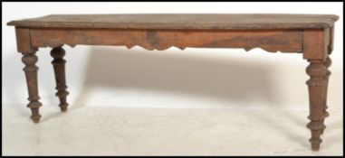 A Victorian 19th century carved oak window seat - duet piano stool. Raised on turned legs with