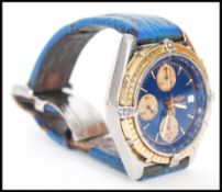 A vintage 20th century Breitling 18ct and stainless steel bi metal watch having a blue dial with
