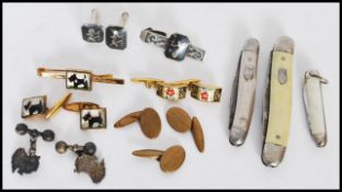 A pair of silver hallmarked gents cufflinks in the form of Australia being hallmarked to the back