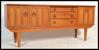 A retro 20th Century teak wood sideboard having a