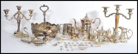 A selection of silver plate wares to include a pilgrim silver plated teapot raised on four feet,
