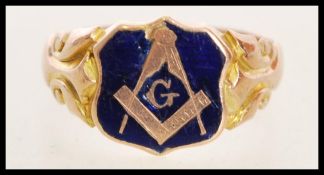 A 20th century 9ct gold hallmarked masonic signet ring with a cobalt enamel head and scroll work