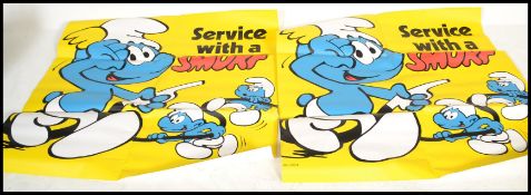 Two large 20th century vintage advertising posters for national petrol from 1978 featuring Smurf's