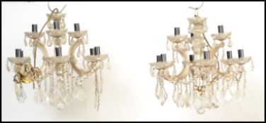 A pair of 20th century antique Empire style chandeliers, each with 9 glass bowl sconces complete