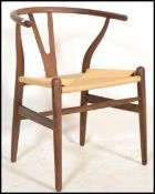 After Hans Wegner - CH24 Wishbone Chair - A retro vintage style chair / armchair comprising