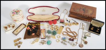 A collection of vintage costume jewellery to include a selection of gentleman's cufflinks and tie