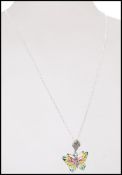 A stamped 925 silver plique a jour pendant necklace in the form of a butterfly. Weight 4.6g.