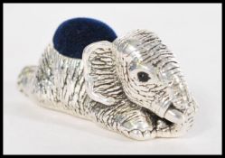 A stamped 925 silver pincushion in the form of an elephant with black gem stone eyes. Weight 22.
