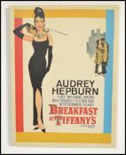 A colourful stretched canvas print of the film Poster ' Breakfast At Tiffany's ' starring Audrey