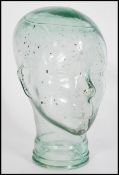 A unusual small 20th century moulded pressed glass phrenology type head shop display stand /