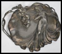 A 20th century Art Nouveau pewter decorative tray of moulded form featuring female figure and iris