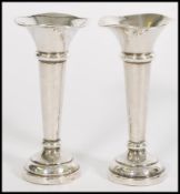 A pair of 20th century silver hallmarked solifleur vases raised on stepper circular bases tapered
