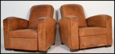 A good pair of 1930's Art Deco French leather club / chesterfield armchairs having arched arms and