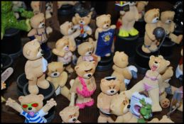 A large collection of novelty Bad Taste Bear figurines to include Mexican bear, Santa, diving