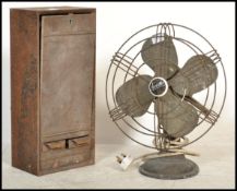 A Vintage early to mid century Industrial office fan by Aeromaster with cage surround together