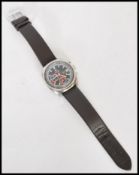 A vintage 20th century Enicar Graphomatc Chronograph watch having a black dial with faceted hands