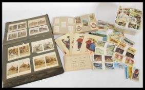 A vintage 20th century post card album with a faux leather cover having 'Post Cards' to the front in