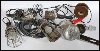 A collection of vintage 20th Century industrial inspection lamps, hanging hooks atop with wire