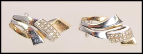 A pair of 20th century stamped 585 14ct white and yellow gold stud earrings of Modernist style