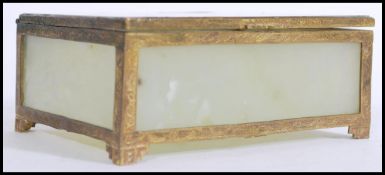 A 20th century Chinese gilt metal and hard stone trinket/ dressing table box, having patterned metal