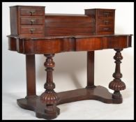 A Victorian 19th century mahogany duchess dressing table with upright trinket drawers having