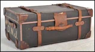 A stunning early 20th Century canvas and cane bound ebonised steamer trunk, retaining all the