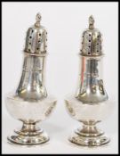 A pair of early 20th century silver hallmarked cruets salt and pepper pot pepperettes by Cornelius