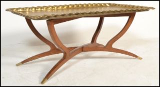 A vintage 20th century Indian / Middle Eastern Islamic brass tray with teak wood folding metamorphic